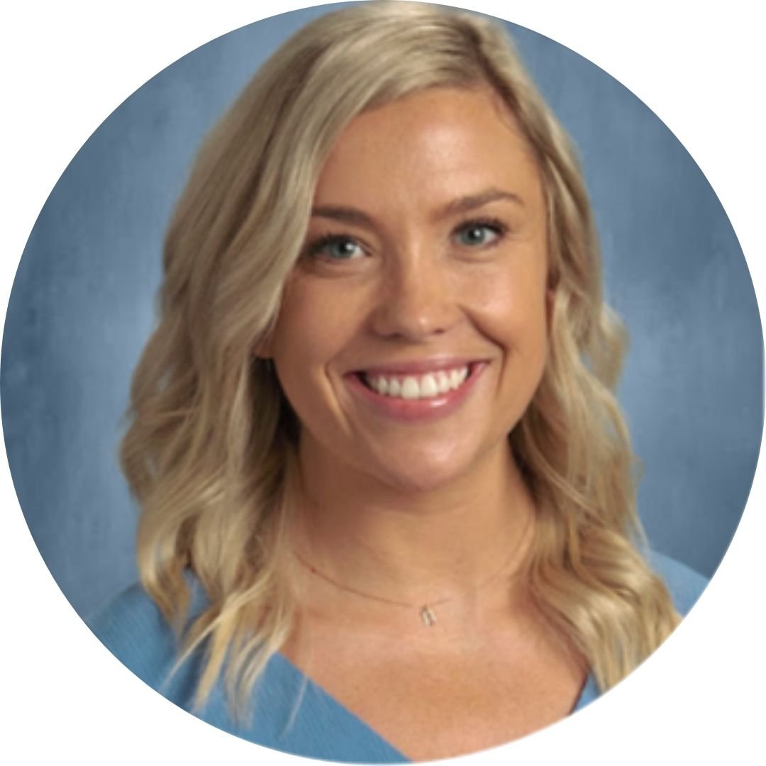woman with blonde hair smiling in front of blue background
