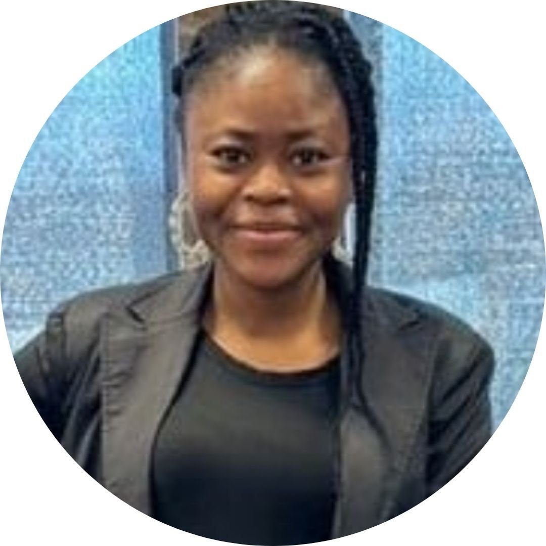 woman wearing black blazer and top smiling