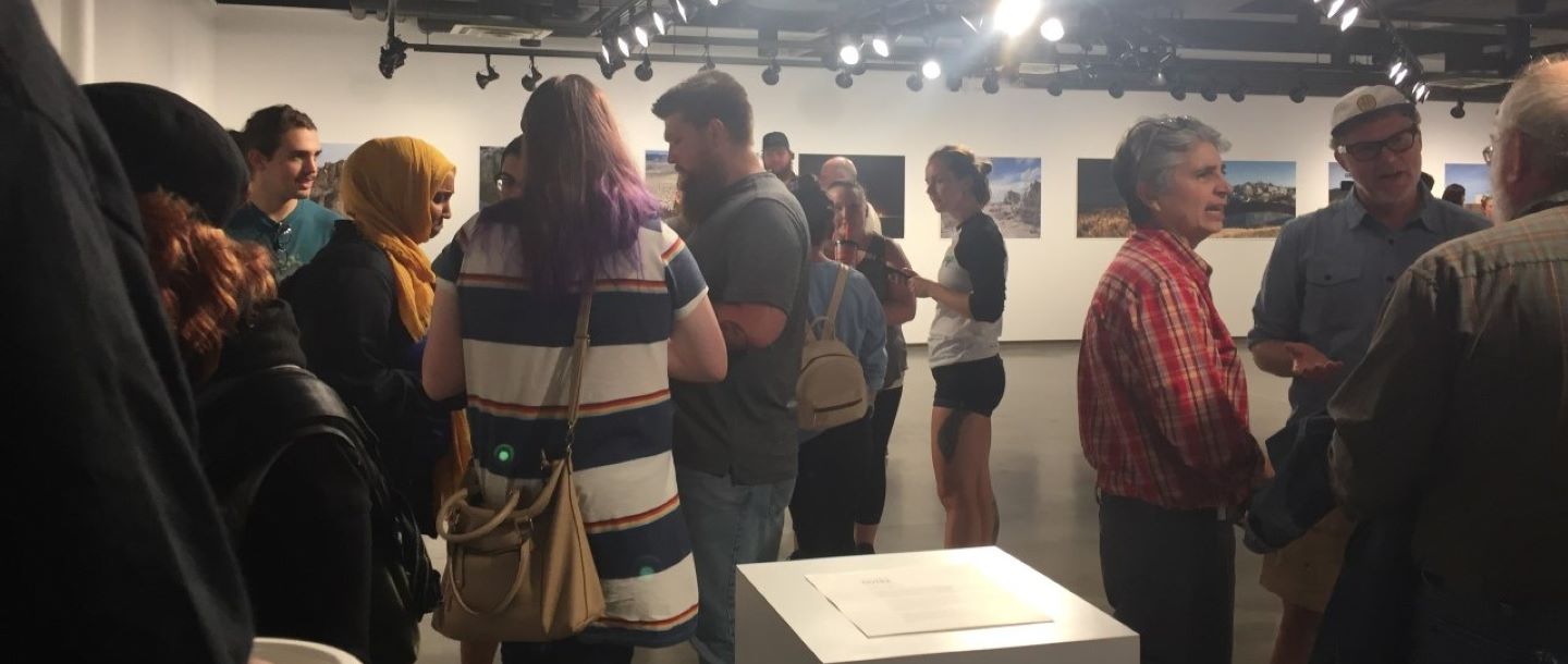 people visiting the Minnesota State University art gallery in Nelson Hall during an art exhibit