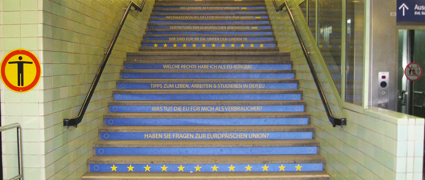 Stairs to underground metro station that have german imprintings on every other step