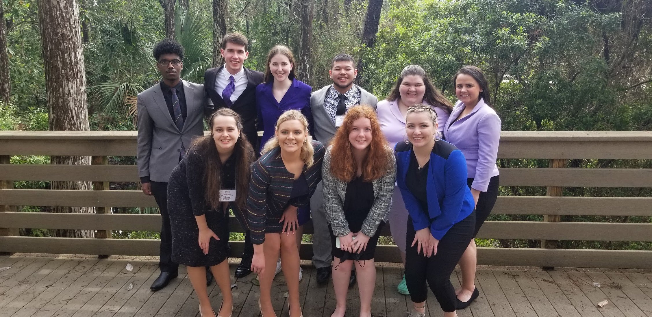 Minnesota State University speech and debate team gathered together for a picture outside on a bridge