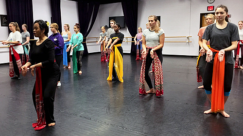 a group of people in a dance studio