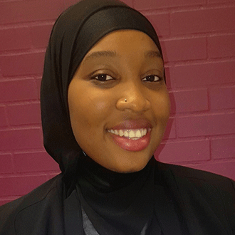 a person wearing a black head scarf