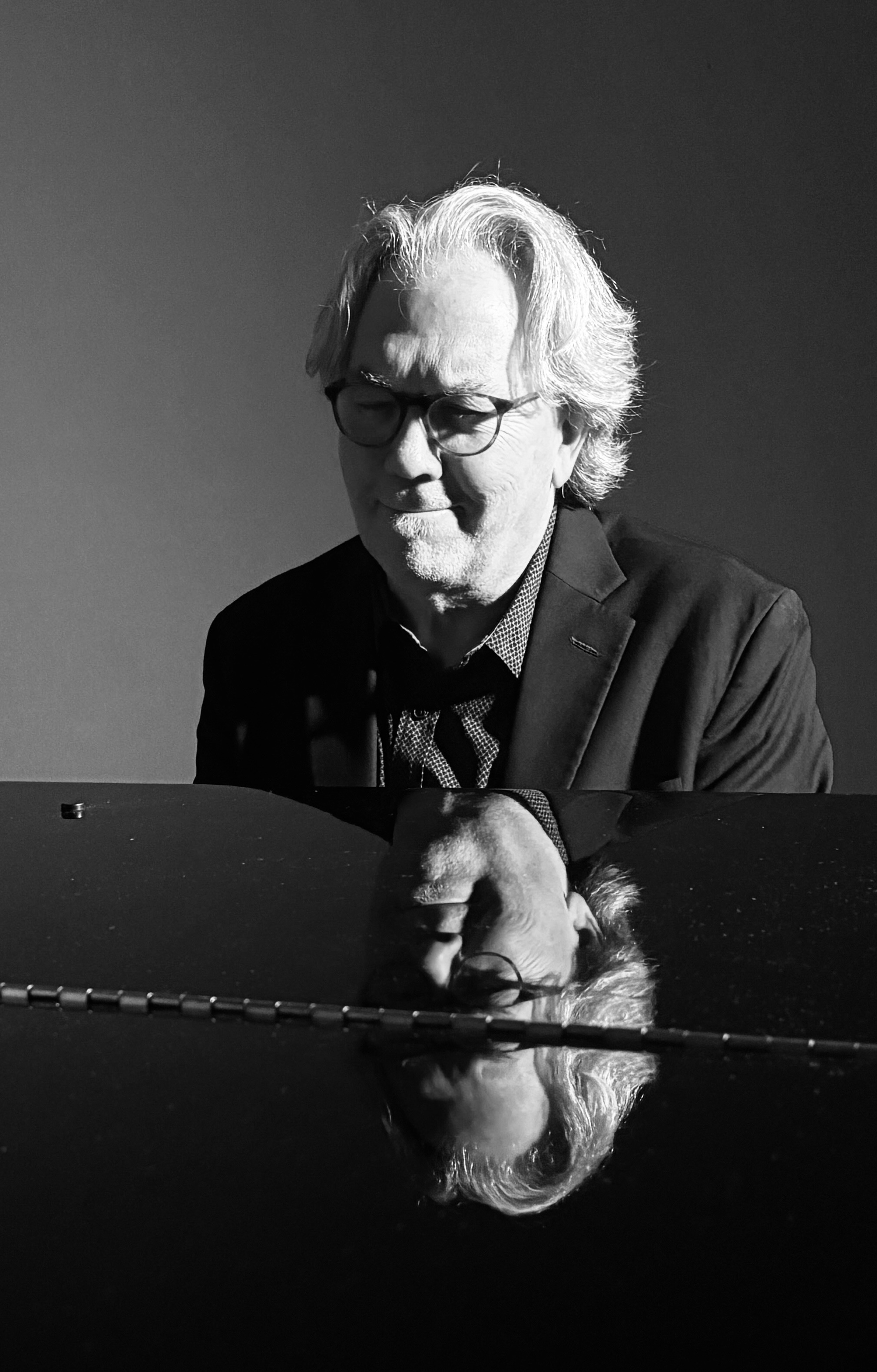 Photo of John McAndrew playing piano