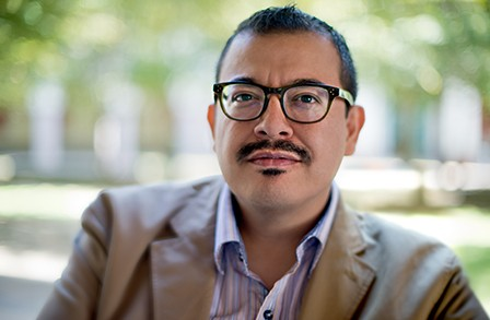 a person with a mustache wearing glasses