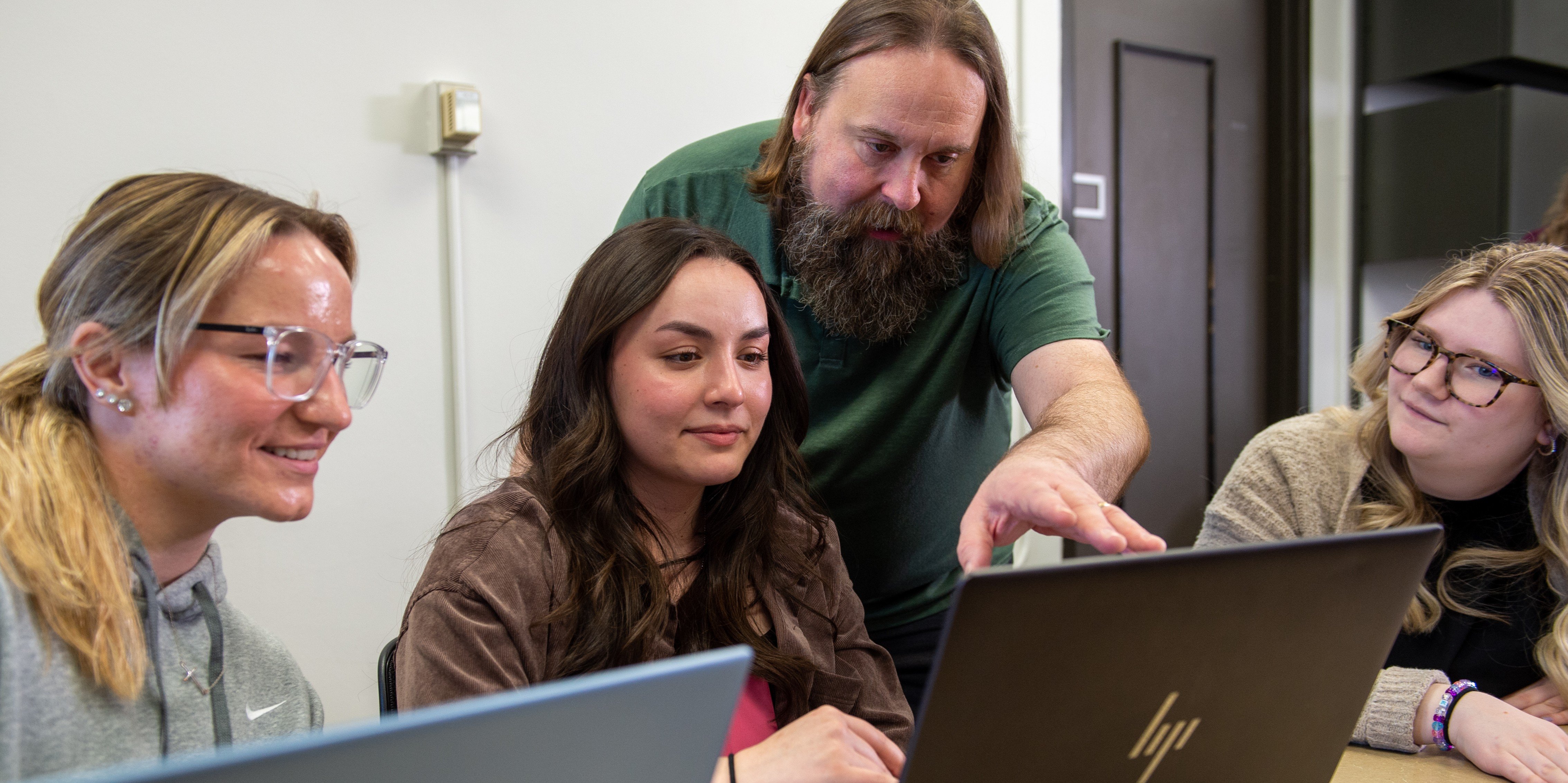 Students learning with professor