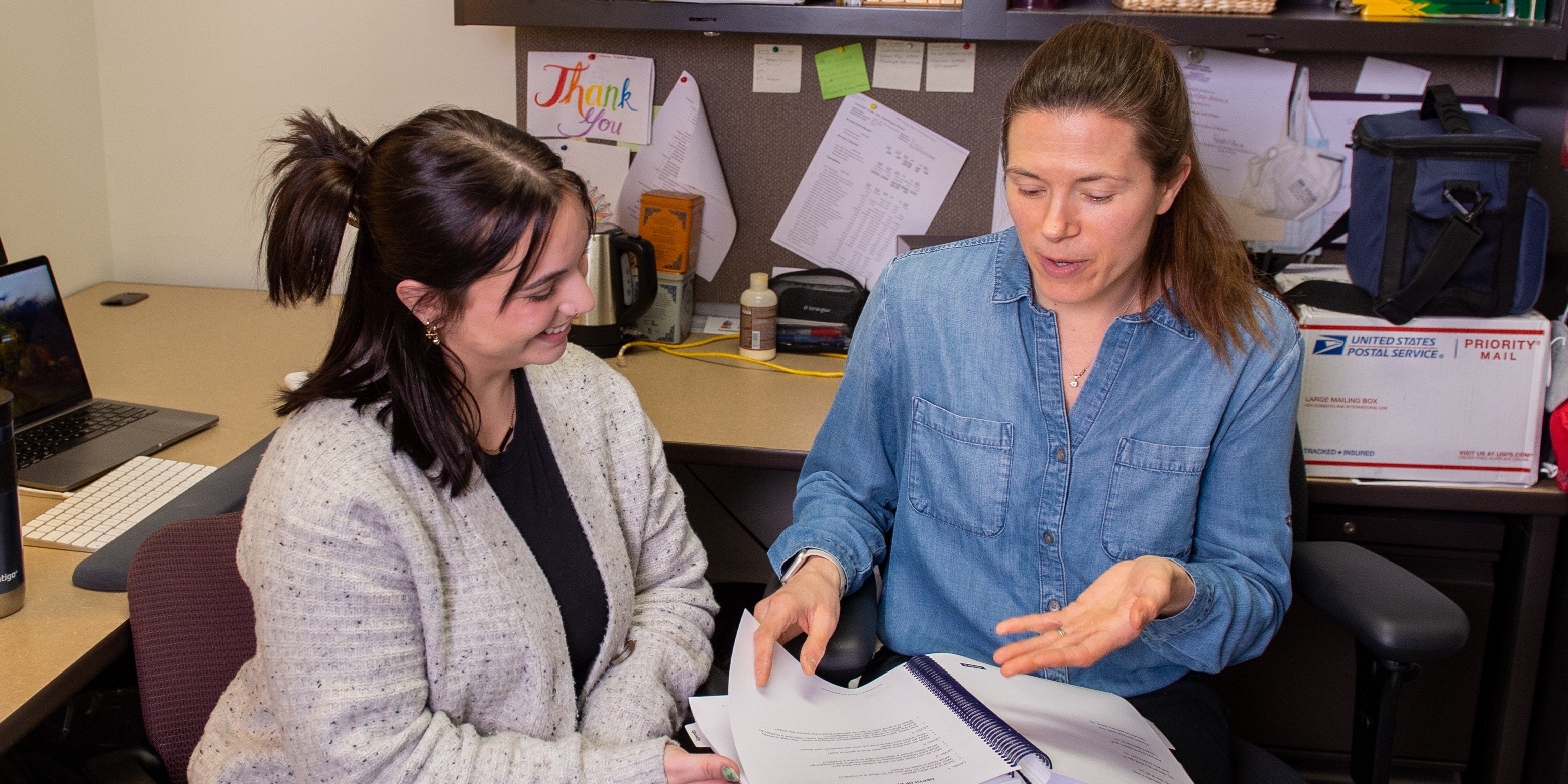 Student and professor in office