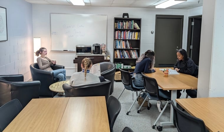 a group of people sitting at tables in a room