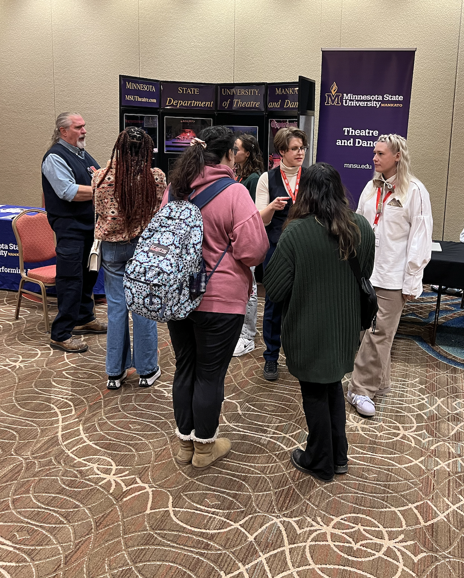 a group of people standing in a room