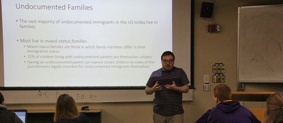 A Corrections professor giving a lecture in the classroom on undocumented families