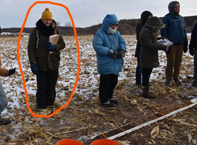 a group of people standing in a field