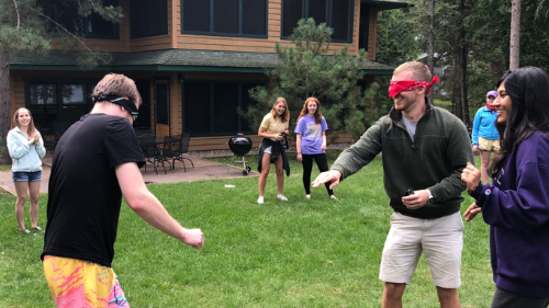 I-O psychology students playing outdoor activities outside at the fall conference