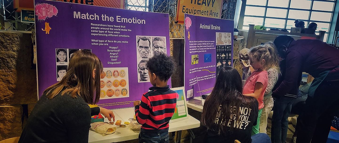 Psychology student with kids at the Childrens Museum