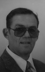 a person wearing sunglasses and a suit