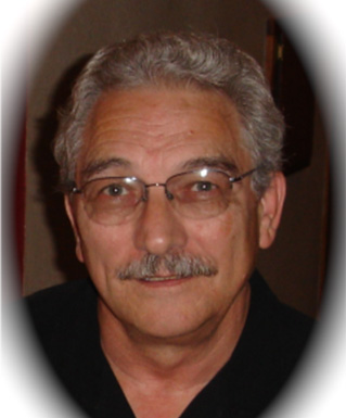 a person with gray hair and mustache wearing glasses