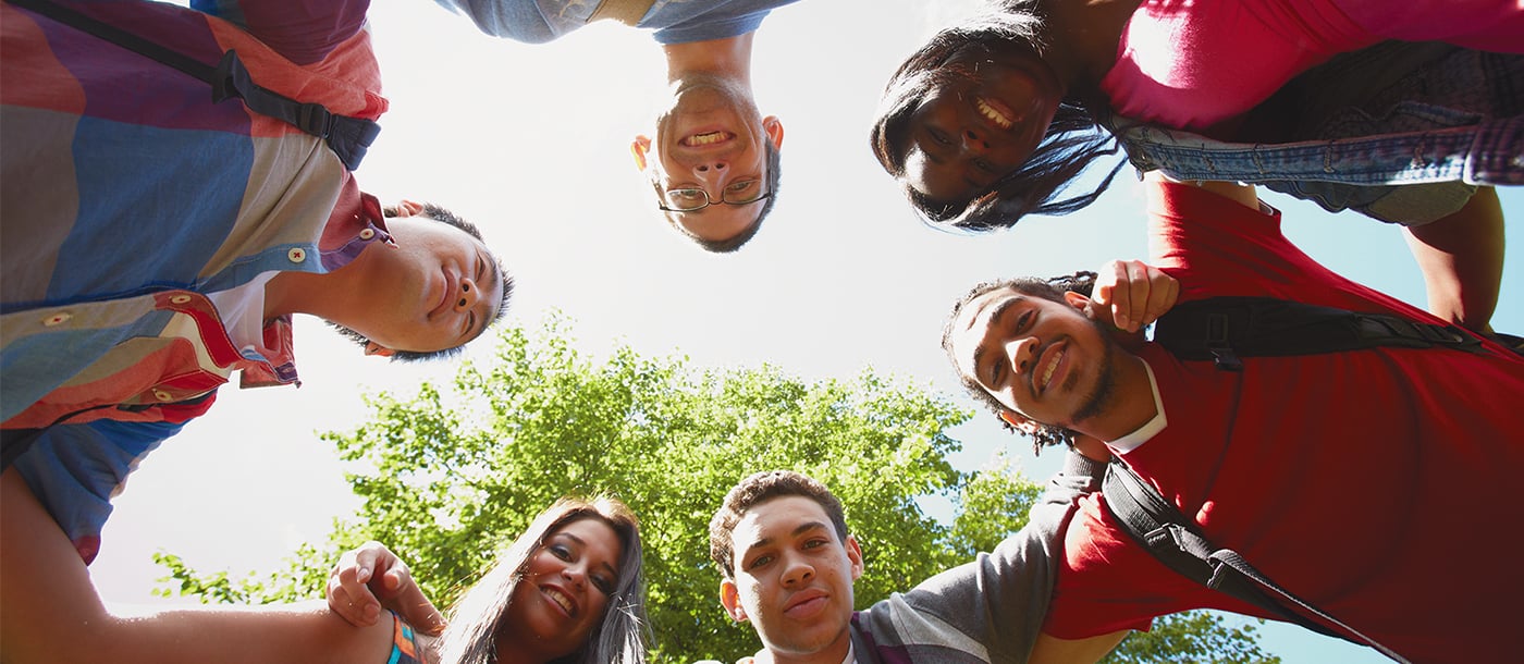 a group of people looking down at the camera