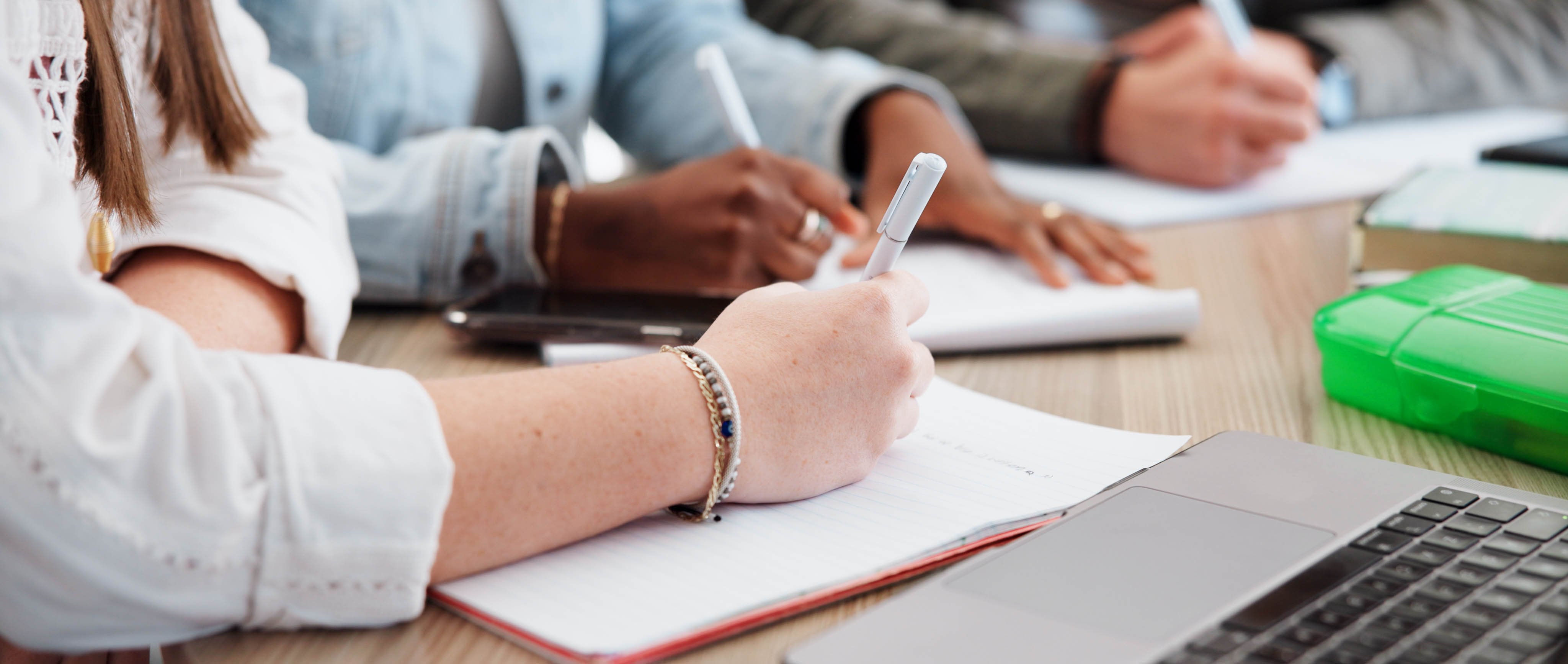 view of teachers at a table writing
