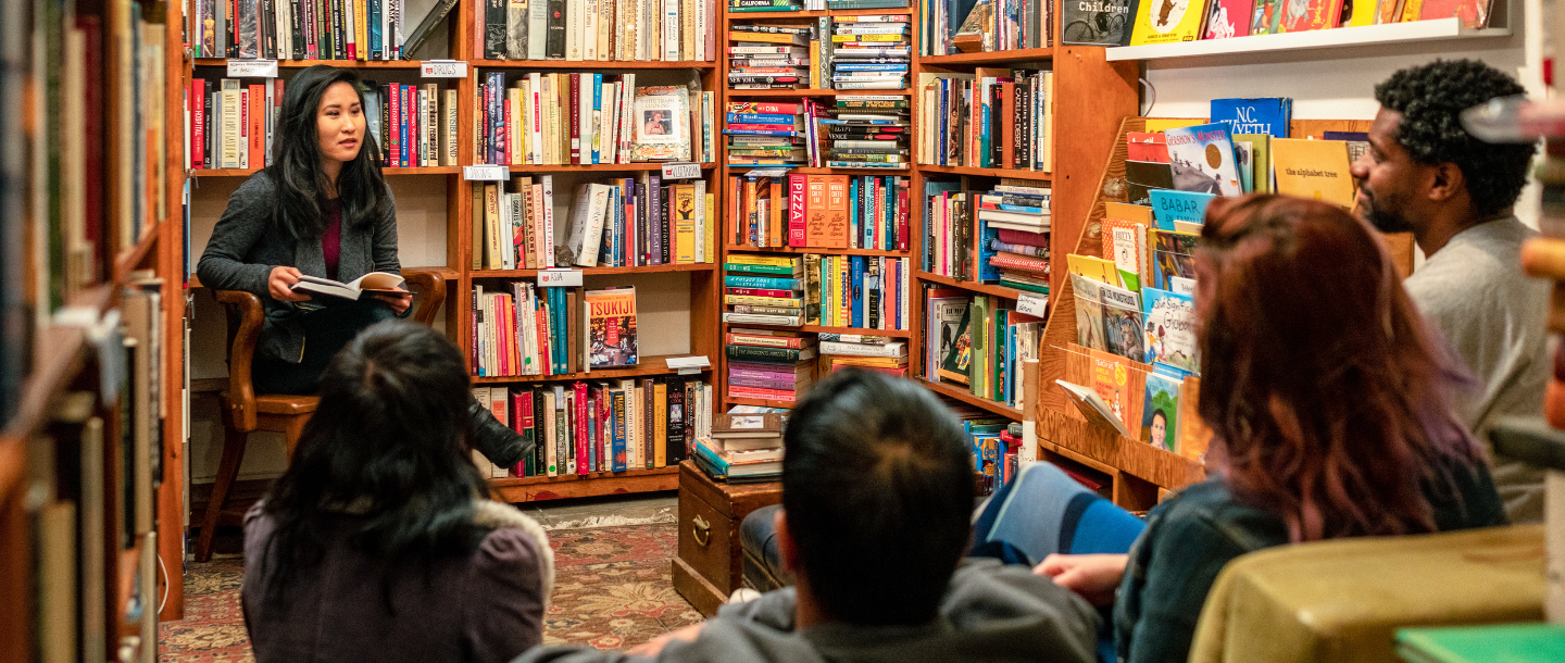 Woman conducting book reading in a bookstore
