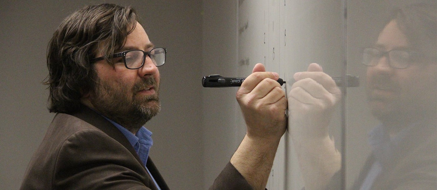 Professor writing on the board